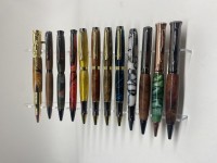 Different pen kits with both acrylic and exotic woods.