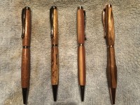 Newly acquired PKSL-3 pen kits. left to right unknown, spalted tamarind, red cedar, zebra wood!